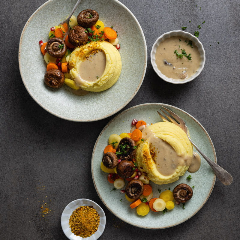 Curry-Kartoffelstock mit cremiger Pilzsauce (vegan)